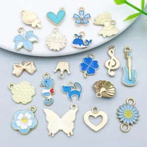 Detailed view of 20 mixed lake blue enamel alloy animal and flower charms for DIY jewelry