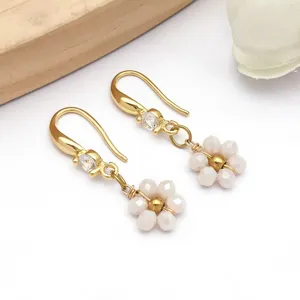 Detailed view of handmade stainless steel daisy flower drop earrings