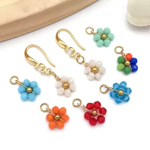 Detailed view of various colorful beaded daisy flower charms for DIY jewelry making