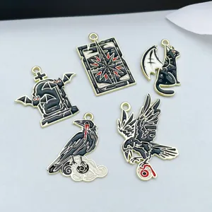 Detailed view of Halloween enamel charms featuring crow dragon and tombstone designs.