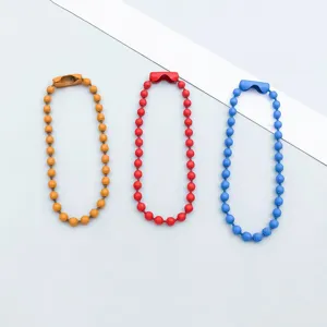 Detail of three colorful painted alloy ball chains for DIY jewelry making and crafts.