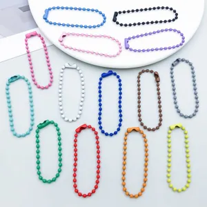 Close-up of colorful alloy ball bead chains in various baked paint finishes for DIY crafts