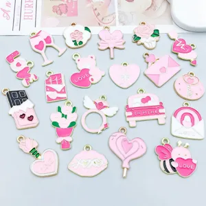 Close-up detail of mixed pink enamel alloy heart and rose charms for DIY jewelry making