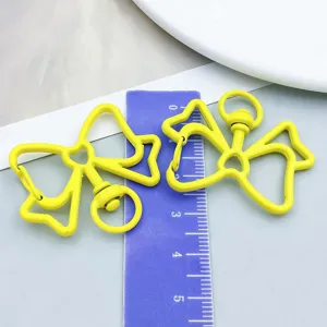 Vibrant yellow bow-shaped alloy lobster clasp keychain hook shown with a ruler for size measurement