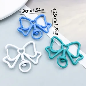 Close-up of colorful bow-shaped alloy keychain clips showing exact size dimensions in cm and inches