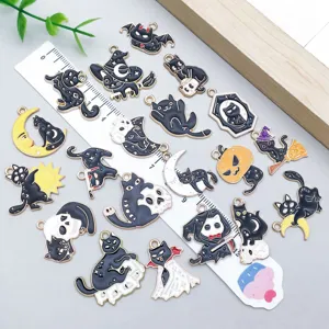 Detailed view of twenty mixed Halloween enamel charms featuring black cats and white skulls