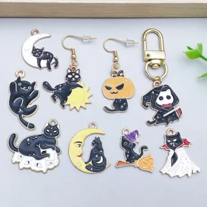 Detailed view of Halloween enamel cat pendants featuring moon pumpkin and ghost skull designs