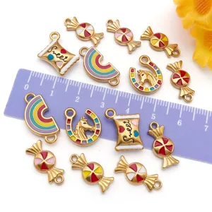 Detail view of colorful enameled candy and rainbow charms with a measuring ruler