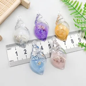 Detailed close-up of colorful resin seashell pendants for DIY jewelry with size scale