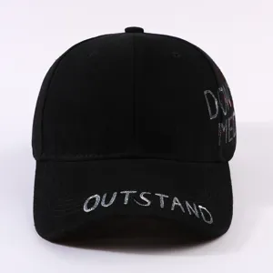 Black baseball cap with white graffiti text lettering brim detail streetwear casual sun hat.