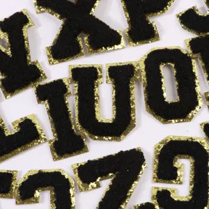 Black chenille letter embroidered patches with gold glitter border for DIY apparel clothing.