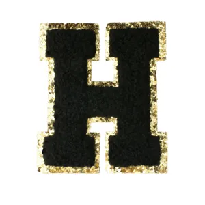 Black chenille letter H patch with gold glitter border for DIY clothing apparel jacket.