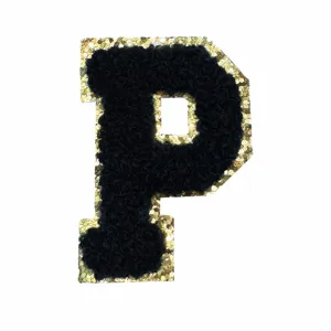 Close up detail view of the black chenille and gold glitter letter P embroidery patch.