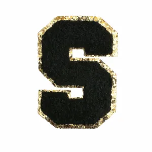 Black chenille letter S patch with gold glitter border for DIY clothing and bags decor.
