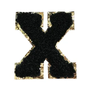 Black varsity letter X patch with gold glitter border, chenille DIY clothing embroidery accessory.