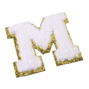 White chenille letter M patch with gold glitter border for DIY clothing apparel jacket.