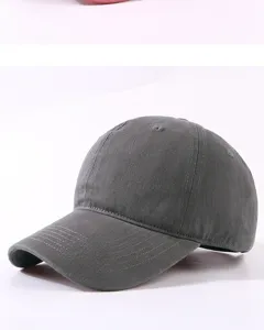 Close up view of the dark gray washed cotton baseball cap showing curved brim and soft top details.