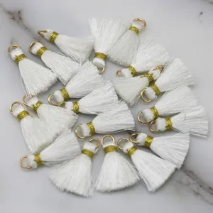 White DIY tassels with gold caps, perfect for handmade jewelry, keychains, and crafts.