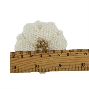 Jute burlap flower craft detail view, natural linen daisy DIY accessory for sewing hats.