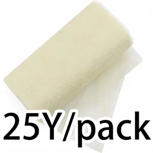 Detail view of beige tulle fabric roll for wedding party decoration and DIY crafts.
