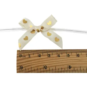 Gold heart print ribbon bow wire detail, perfect for gift box packaging and hair clip DIY crafts.