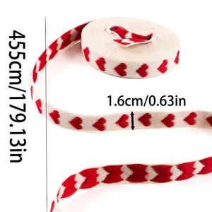 Detailed view of red heart jacquard ribbon roll, perfect for gift wrapping and crafts.