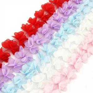 Detail of 50mm chiffon flower lace ribbon trim, perfect for DIY crafts and gift wrapping.