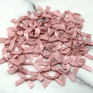 Pink satin ribbon bows set for DIY hair clips, gift box decoration and craft making supplies.