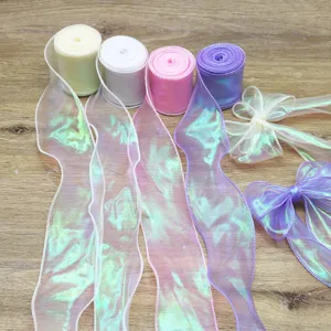 Close-up detail of colorful iridescent organza ribbons and bows for DIY gift wrapping.