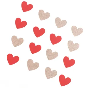 Heart confetti for Valentine wedding party decoration, red and glitter gold paper pieces.
