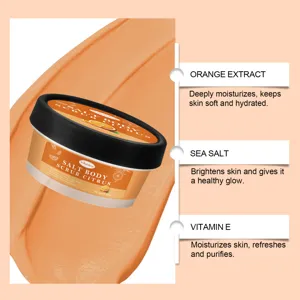 Orange body scrub detail showing citrus texture, sea salt and vitamin E for smooth skin.
