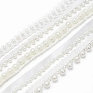 Close up detail of white pearl lace trim and ribbon, perfect for DIY crafts and clothing accessories.