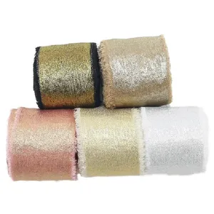 Metallic frayed edge ribbon detail view, shimmering glitter fabric trim for gift wrapping and DIY.