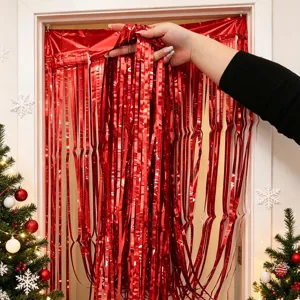 Red foil fringe curtain for Christmas party decor, sparkling door backdrop for holiday DIY.