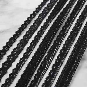 Black cotton lace trim detail view, perfect for DIY clothing decoration and gift wrapping.