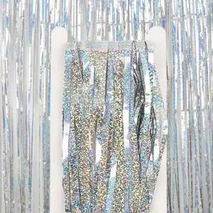 Close-up detail of holographic tinsel foil fringe curtain, shiny party backdrop decoration.
