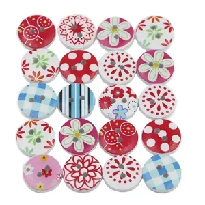 Close-up detail of mixed color wooden buttons with 2 holes and floral polka dot printed patterns.