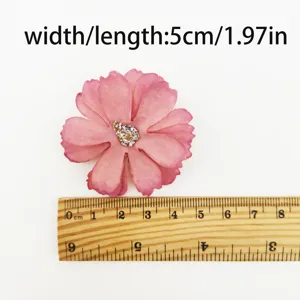 Pink artificial flower head detail, 5cm craft DIY accessory for party decoration.