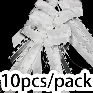 White heart-edged ribbon bows detail shot, wedding party decoration craft supply.