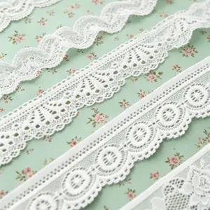 White stretch lace trim, delicate floral ribbon for sewing, garments, and DIY crafts detail.