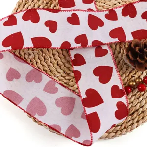 Valentine's day red heart printed ribbon close-up, wired edge detail for gift wrapping DIY.