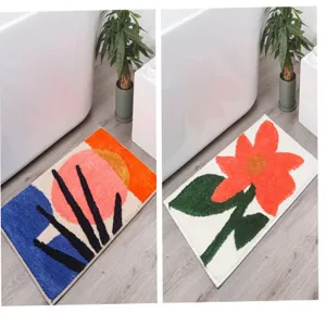 Tufted bathroom mat detail view showing creative floral and abstract geometric floor rug designs.