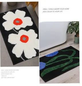 Tufted floral rug for bathroom and balcony, soft absorbent non-slip black doormat.