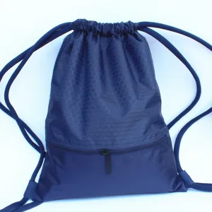Dark blue nylon drawstring backpack with honeycomb pattern and front zipper pocket for travel.