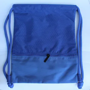 Blue nylon drawstring backpack with honeycomb top pattern, front zipper pocket detail view.