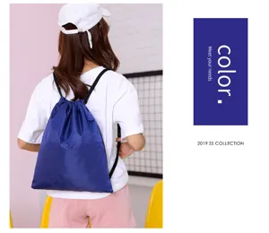 Blue drawstring backpack detail view, lightweight sports gym sack for casual travel and fitness.
