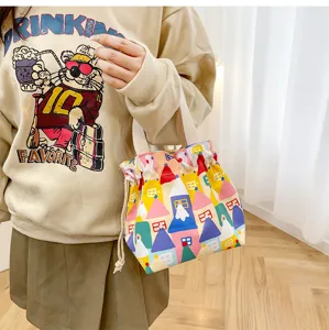 Cute canvas drawstring lunch bag with colorful house print, portable small handbag for daily use.