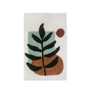 Modern abstract tufted floor mat with leaf pattern, non-slip plush area rug for home decor.