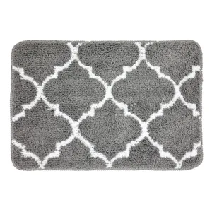Grey tufted bath mat with white geometric pattern, soft absorbent non-slip rug for home.
