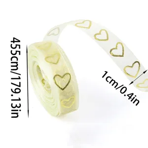 Sheer ribbon roll with gold heart pattern, 1cm wide and 455cm long for gift wrapping.